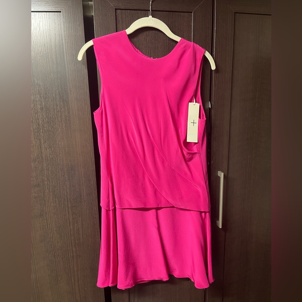 Sleeveless pink dress. Great for a summer wedding or party.